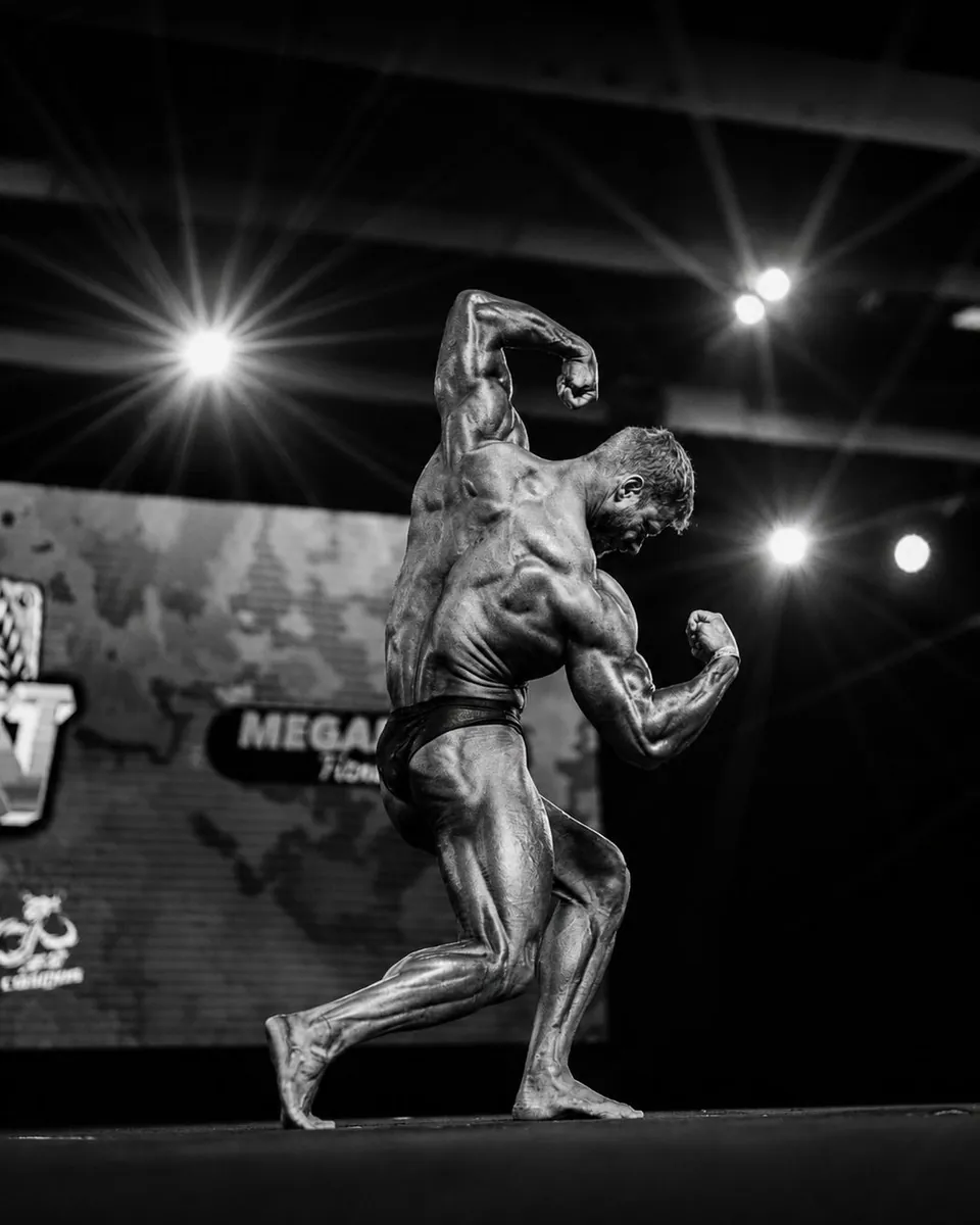 Robin Hofer competing on a bodybuilding stage